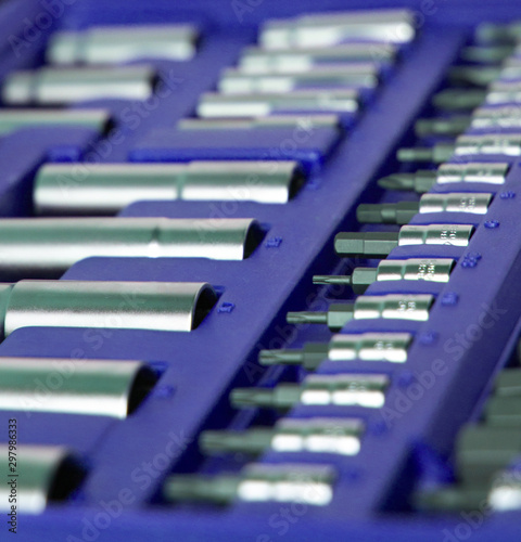 A lot of different tools in the violet box. Tools for home workers, factory workers, auto mechanics and other works.