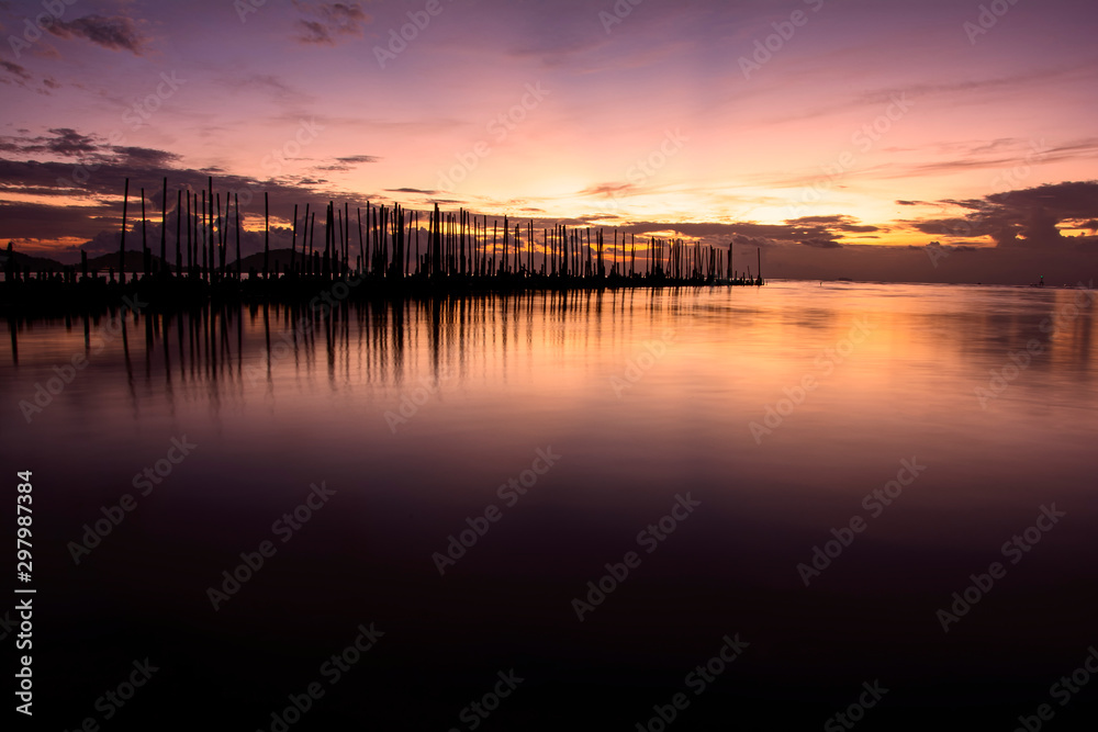 The Wood bridge on beach at sunrise in Phuket Thailand.