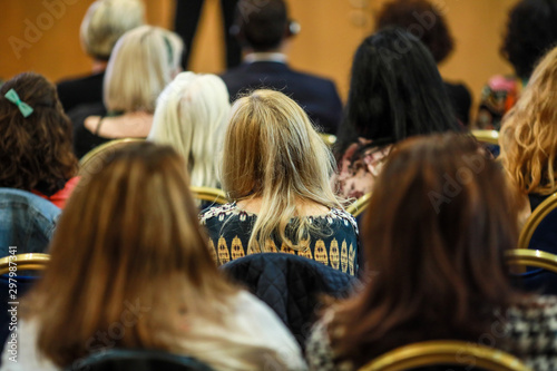 Women in the audience attending a conference - women targeted events.