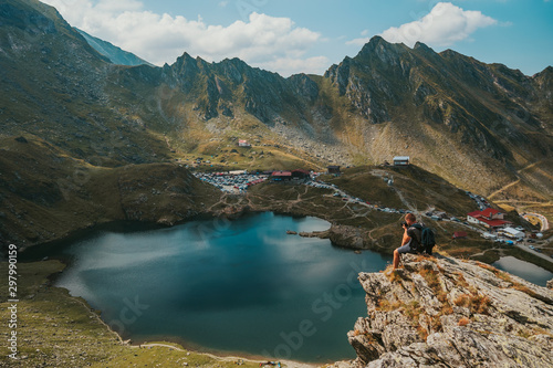 Photographer takes the picture Panorama from 2000 meters altitude where you can see Bâlea Lac, Bâlea Lac chalet and Transfăgărășan road.