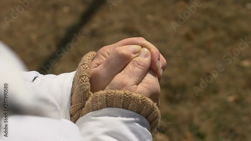 Mature female holding dollar hand, retirement poverty, social insecurity, budget