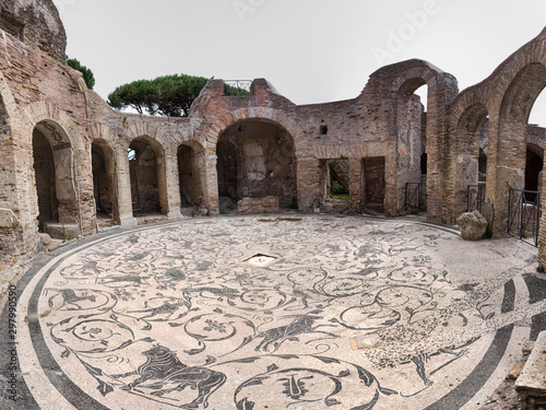 panoramic view of the circular hall of the seven wise thermal baths in archaeological excavation of Ostia Antica, with the beautiful polychrome mosaic heritage of Roman art, Rome, Italy photo