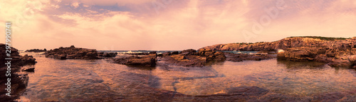 Wilderness seascape at twilight in this suggestive 180 degree Immersive panorama with rock formations carved by wind and clear seas
