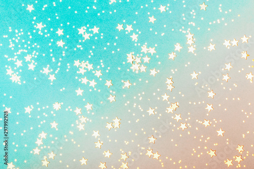 Trendy coral and blue background with golden stars. The concept of celebrations, the Day of St. Valentine, Christmas, New Year, holiday, birthday, etc.