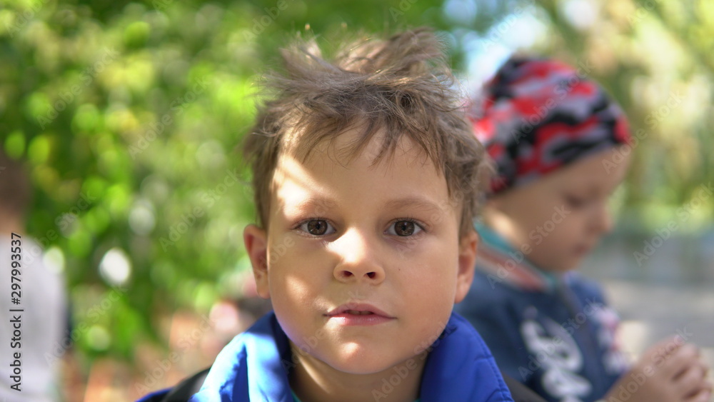 Clouse up portrait Little child with disheveled hair in the kindergarden Clouse up portrait Little child with disheveled hair in the kindergarden