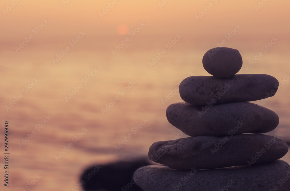Zen concept. Sunset. The object of the stones on the beach at sunset. Relax & Meditation. 