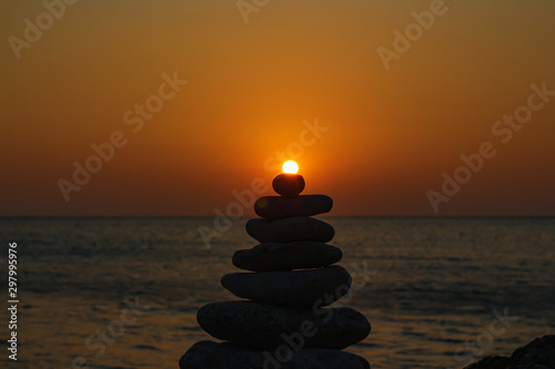 Zen concept. The object of the stones on the beach at sunset. Harmony   Meditation. Zen stones.