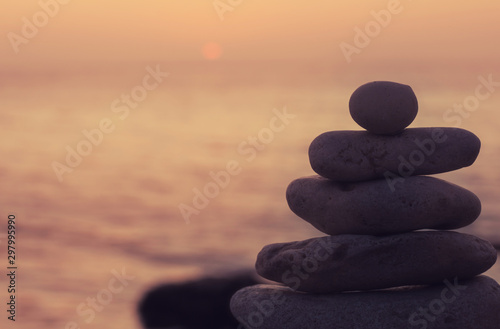 Zen concept. Sunset. The object of the stones on the beach at sunset. Relax   Meditation. 