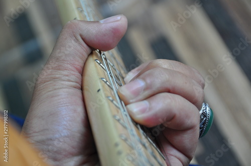 hands of woman/ Finger and how to play guitar photo