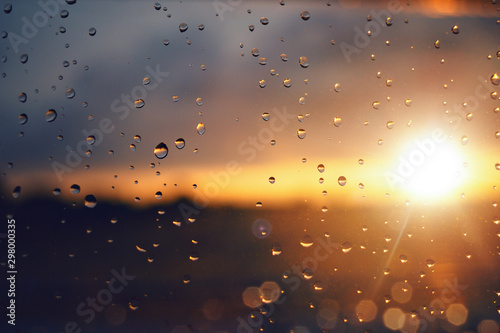 Photos Raindrops on a windowpane at sunset
