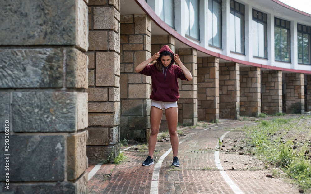 Sporty young woman on running workout. Female athlete training on autumn. Sporty young woman on running workout. Female athlete training on autumn.