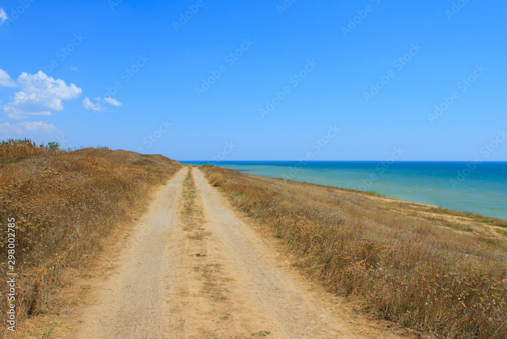 Beautiful dirt road by the sea Beautiful dirt road by the sea