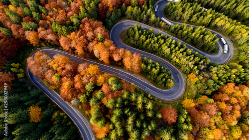 Aerial view of forest road in beautiful autumn .at sunset. Curved road in the mountains with truck traffic and nice landscape © aboutmomentsimages
