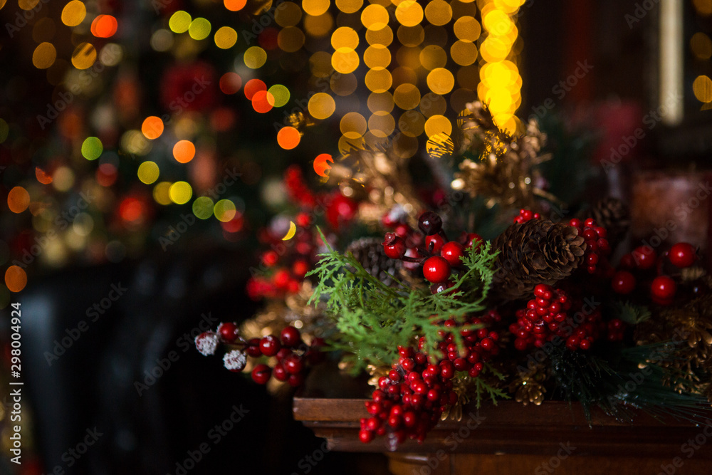 Christmas toys, garlands and interior elements in lights, home decoration for the holiday. Tied cinnamon sticks, kerosene lamp, glowing stars, lights in the side. - obrazy, fototapety, plakaty 