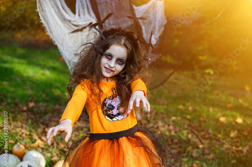 Girl transformed into smiling zombies, costume for halloween.