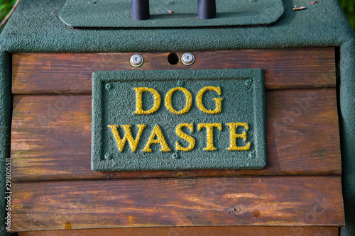 A dog waste bin in woodland