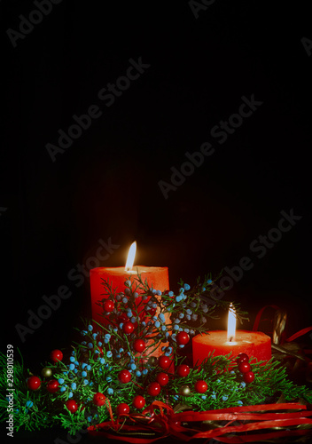 still life for christmas, red candles and coniferous branches