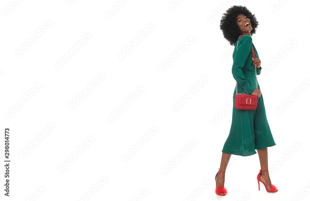 Perfect, total look of happy african woman in green dress and red accessories. Perfect, total look of happy african woman in green dress and red accessories.