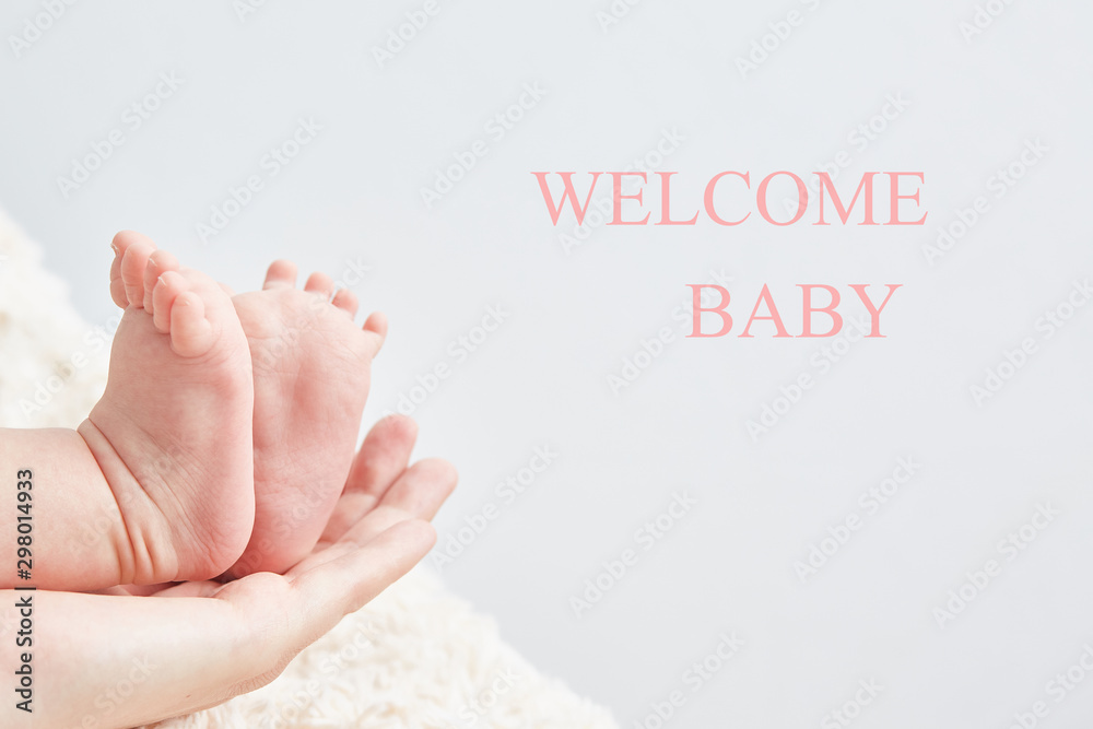 Blank party invite. Baby Shower Card. Baby legs on mom's hand close-up. Blank party invite. Baby Shower Card. Baby legs on mom's hand close-up.