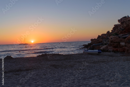 Sunset at Cala Saona, Formentera, in the distance Es Vedra Rock is visible