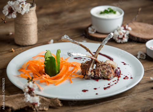 fried meat with vegetablesin the plate photo