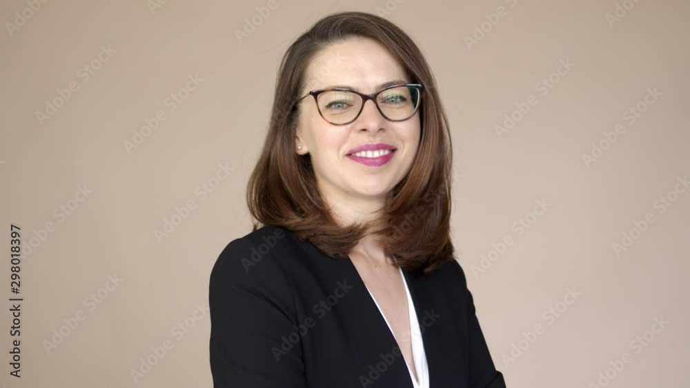 Portrait of a businesswoman with glasses smiling and happy Portrait of a businesswoman with glasses smiling and happy