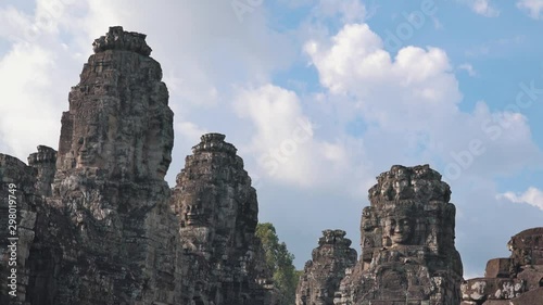 Medium Timeplase of the Bayon Temple Faces Near Angkor Wat photo
