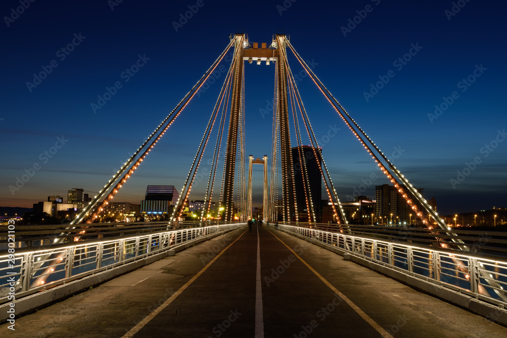 Fototapeta premium Cable stayed pedestrian bridge across the Yenisei Krasnoyarsk