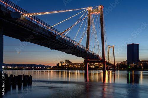 Krasnoyarsk view of the night city and the pedestrian bridge over the Yenisei