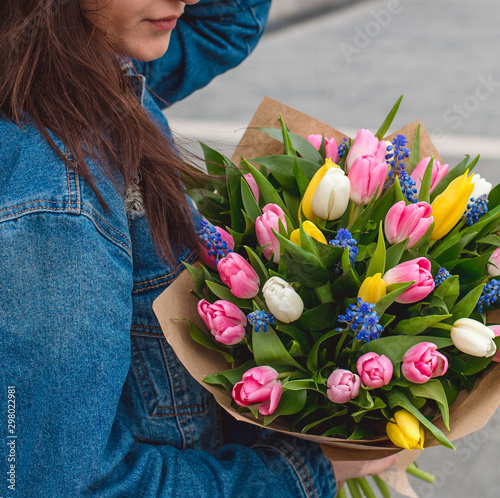 tulips bouquet in girl hands