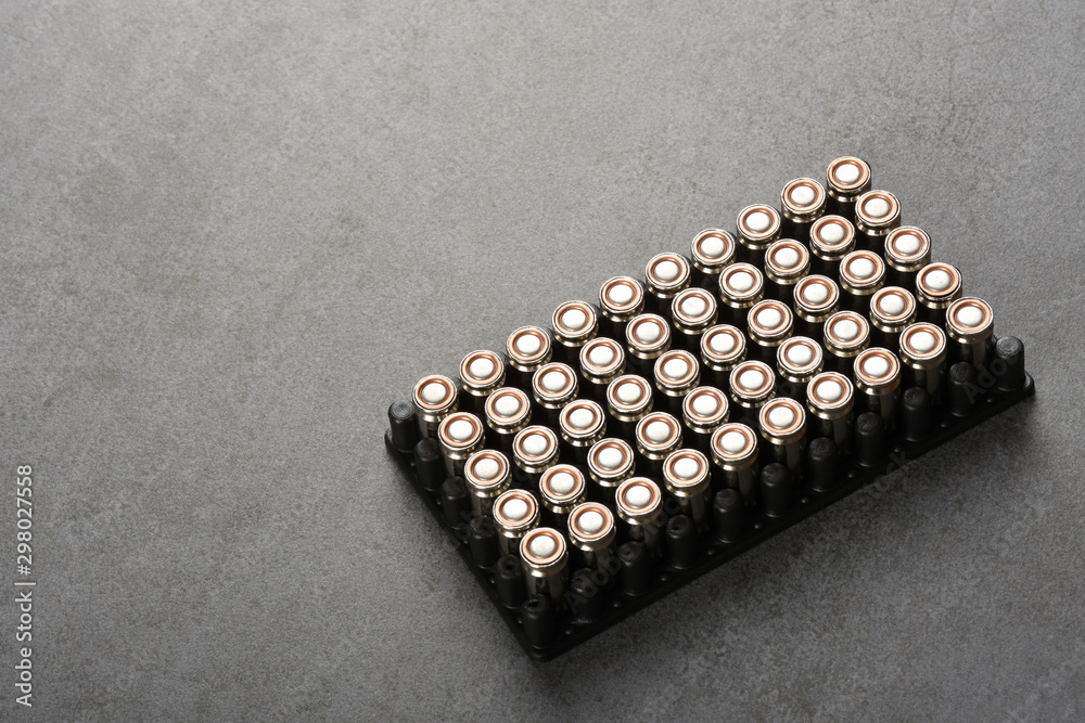 Group of bullets on gray stone texture with copy space Group of bullets on gray stone texture with copy space