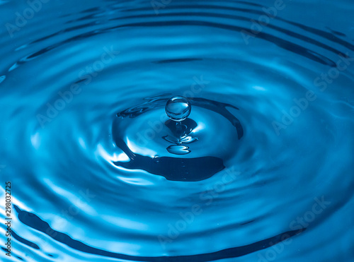 blue glass colored water drop splash