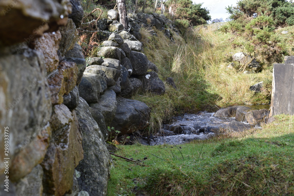 stone wall and small river countryside