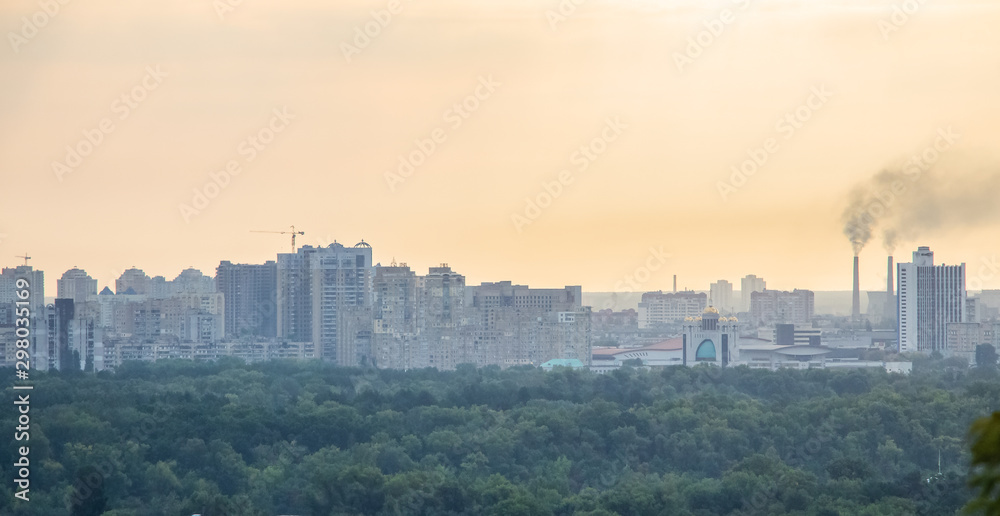 Tour of Kiev in the center of Europe. View of the Dnieper, Trukhanov island and a foot bridge. Park fountain and sunset on the horizon..