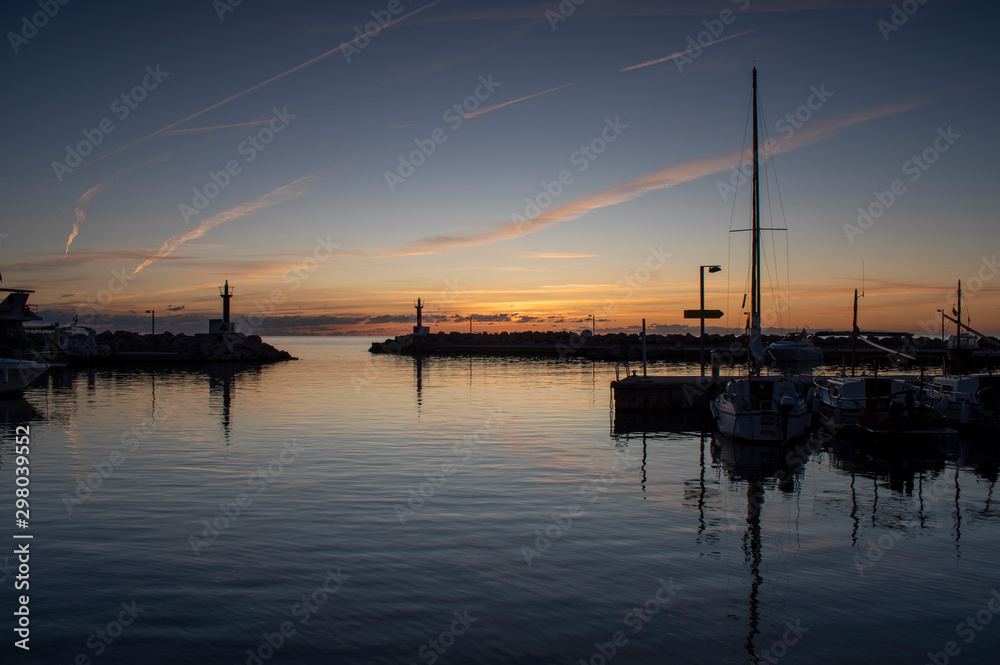 Sunrise over Cala Bona Majorca Marina full of vibrant colours and the promise of a beautiful day. Sunrise over Cala Bona Majorca Marina full of vibrant colours and the promise of a beautiful day.