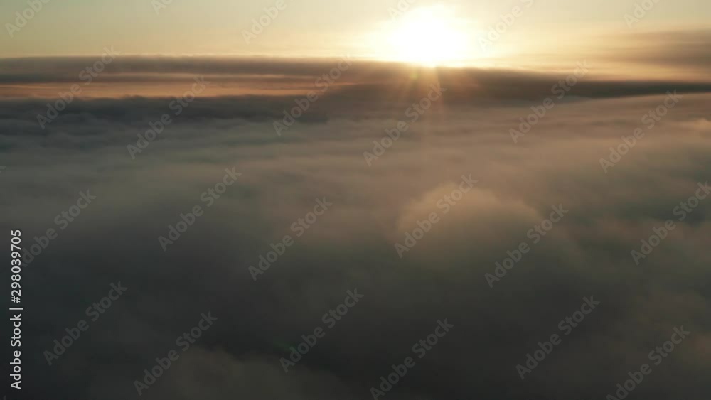 Sunrise cloudy aerial view over fog and mist establishing aerial Sunrise cloudy aerial view over fog and mist establishing aerial