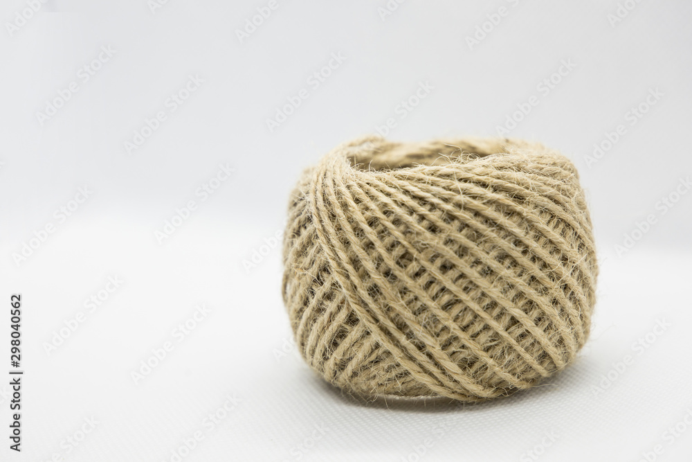 A roll of light brown color string A roll of light brown color string