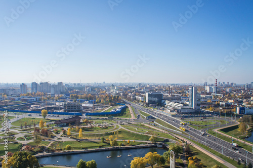 City architectural landscape Minsk. Office buildings of the road and parks. View from the roof with blue sky. © Payllik