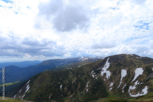 Wonderful Alps mountains in summer season with clouds in background. photo