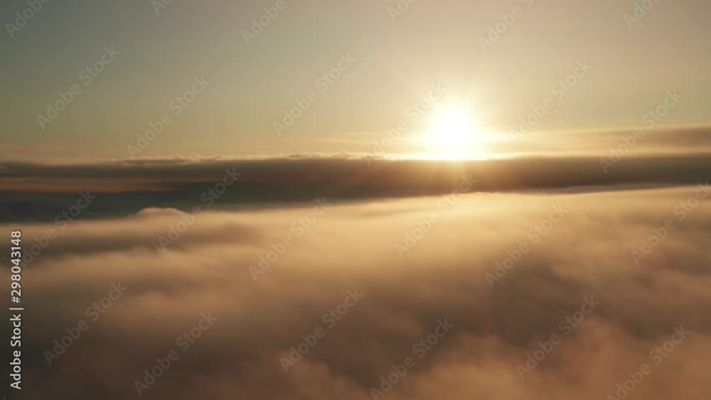 Timelapse aerial view above the clouds at sunrise for a spectacular establishing aerial Timelapse aerial view above the clouds at sunrise for a spectacular establishing aerial