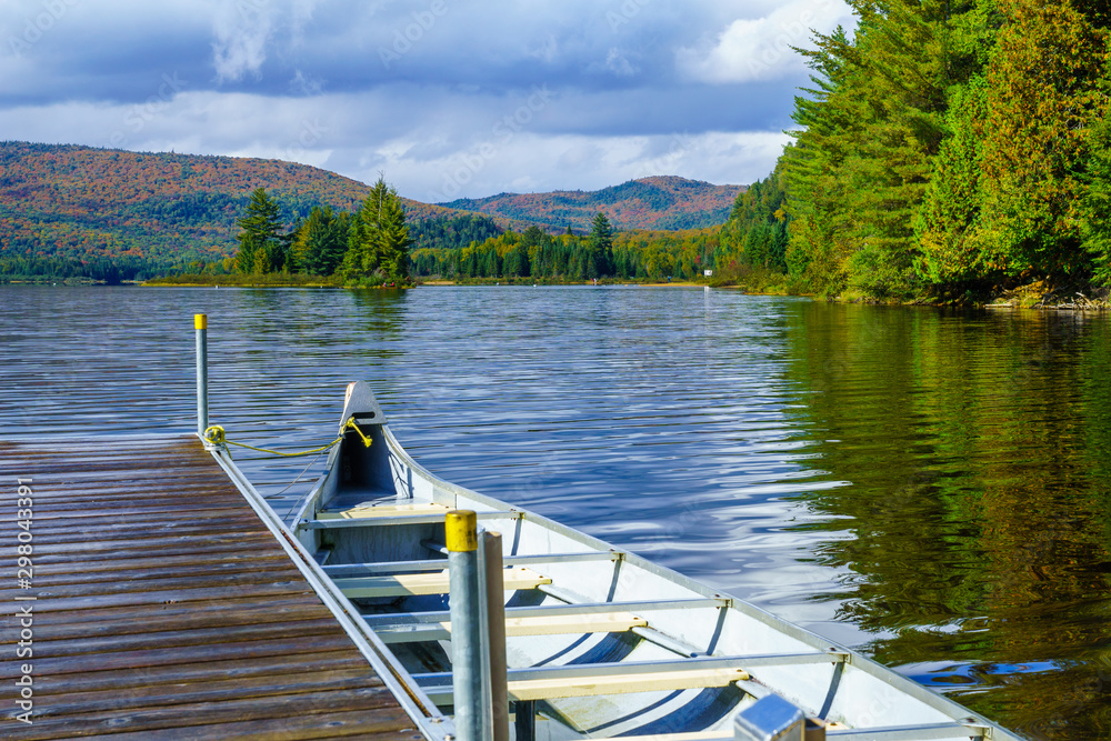 Pier and boat in Monroe Lake, in Mont Tremblant National Park Pier and boat in Monroe Lake, in Mont Tremblant National Park