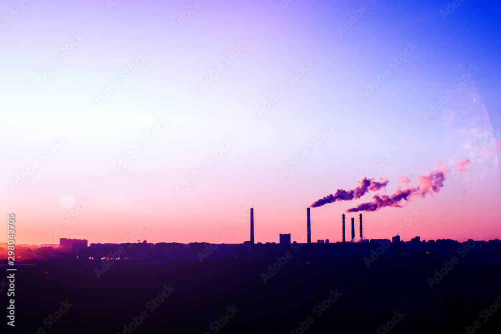 Sunrise silhouette of city landscape with smoking factory, ecology pollution concept