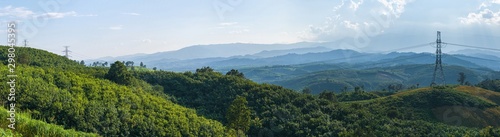Panoramic landscape view of the high voltage post, High voltage tower and mountain in Forest