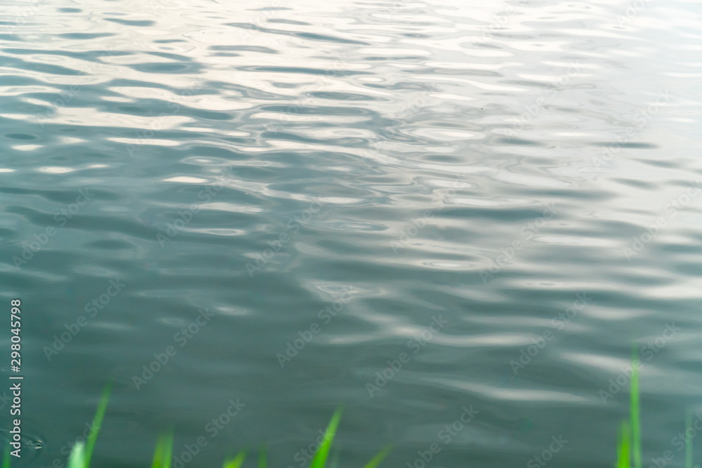 Reflection of golden sunset sky on the water surface. Reflection of golden sunset sky on the water surface.