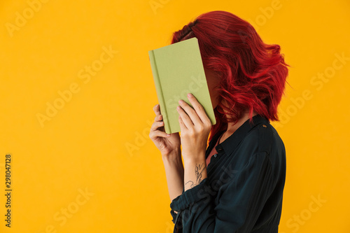 Image of caucasian woman covering her face exercise book