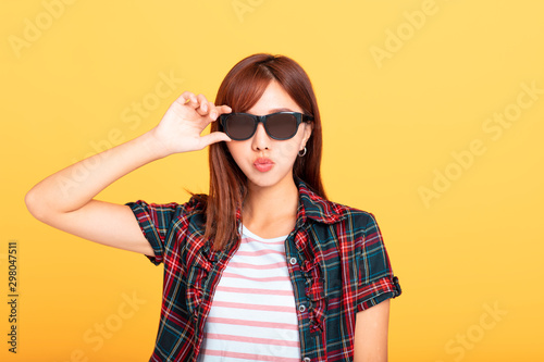 Portrait of beautiful young woman in sunglasses
