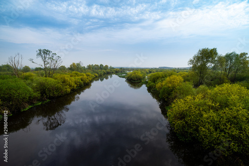 River and trees on calm day. Natural landscape © Abiwoo