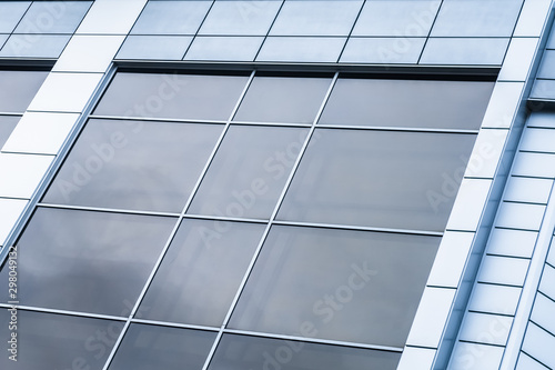 close-up of a modern glass building with square blue glass