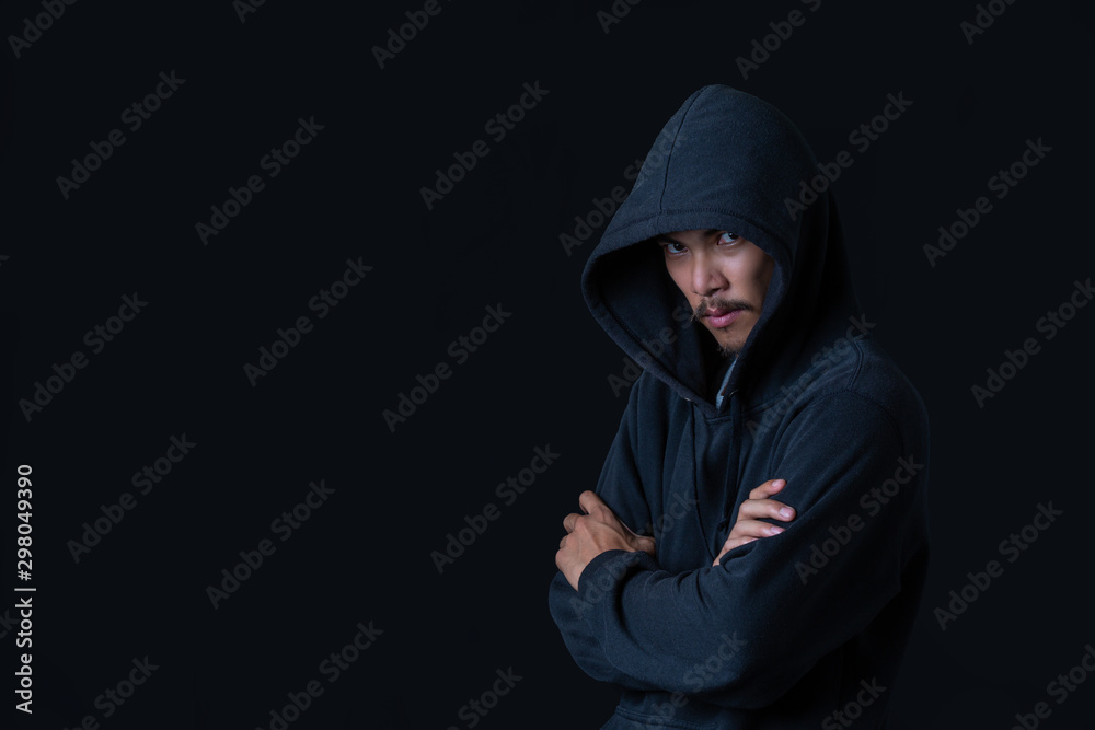 The concept of cyber theft. The hacker standing on her arms against the black background. The concept of cyber theft. The hacker standing on her arms against the black background.