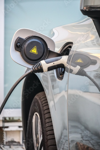 Photomontage charging electric car mixed media with nature and grain